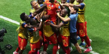 DR Congo celebrates taking the lead over Uzbekistan with a group huddle on the pitch