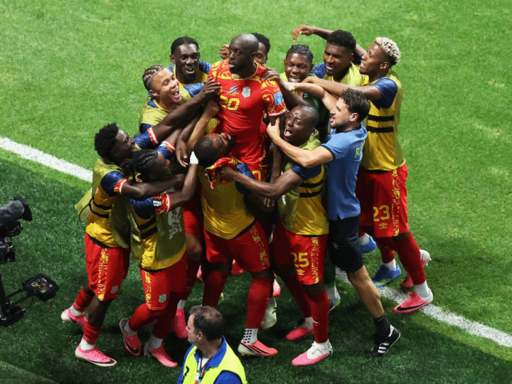 DR Congo celebrates taking the lead over Uzbekistan with a group huddle on the pitch