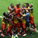 DR Congo celebrates taking the lead over Uzbekistan with a group huddle on the pitch