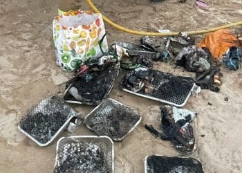 Disposable BBQs littered on beach in Cornwall