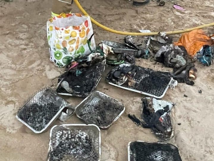Disposable BBQs littered on beach in Cornwall