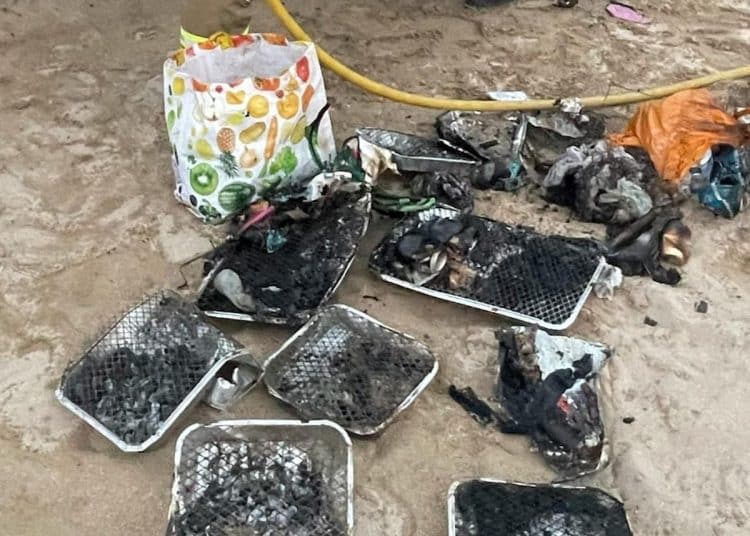 Disposable BBQs littered on beach in Cornwall