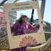 A festival goer poses in a photo frame at Eid on the Square 2026
