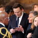 Elon Musk checks phone