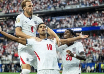 Harry Kane, Jude Bellingham and Noni Madueke celebrate on the pitch during England's winning game against Croatia on 18 July 2026