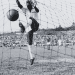 Brazilian footballer Pele in the net after scoring for Santos