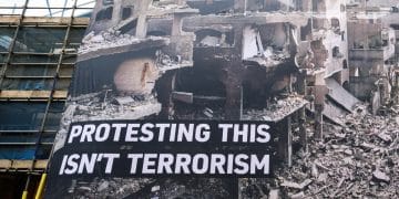 Huge banner shows destruction in Gaza and says: Protesting This Isn't Terrorism Palestine Action