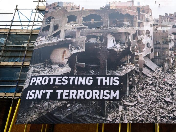 Huge banner shows destruction in Gaza and says: Protesting This Isn't Terrorism Palestine Action
