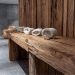 Folded Beige Towels Ready for Use in Spa on Rustic Wooden Table