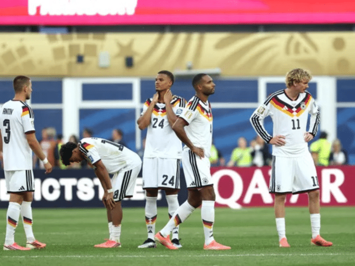 (From Left) Germany's defender #03 Waldemar Anton, defender #18 Nathaniel Brown, defender #24 Malick Thiaw, defender #04 Jonathan Tah and forward #11 Nick Woltemade react after losing the penalty shootout during the 2026 World Cup round of 32 football match between Germany and Paraguay at the Boston Stadium in Foxborough on June 29, 2026.
