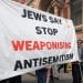 Banner saying Jews Say Stop Weaponising Antisemitism Criticism of Israel is not antisemitic