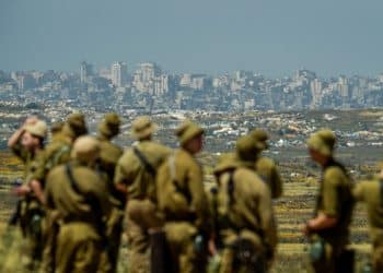 IOF soldiers looking at destroyed town of Jabalia in Gaza