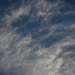 An Israeli air-force single isolated drone in the distance with partly cloudy background. This is not a photo of Israel's AI killer drones in the story.