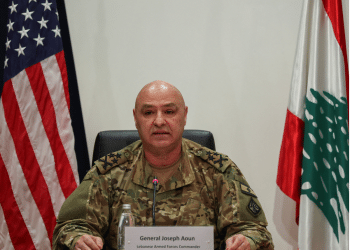 President of Lebanon, Joseph Aoun, in his army uniform with US and Lebanon flag behind him on either side