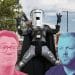 Composite image showing Andy Burnham, Count Binface and Rob Kenyon in front of a street scene in Makerfield