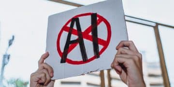 Hands holding a placard with AI crossed out SAG-AFTRA and Equity AI campaigns