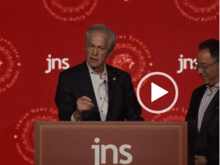 A screenshot of a video of Norm Coleman on stage at the The JNS 2026 Summit in Jerusalem in June 2026 where he made the comment about Jews