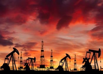 Oil field at sunset, illustrating fossil fuel financing