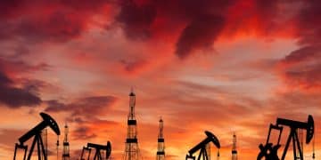 Oil field at sunset, illustrating fossil fuel financing