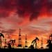 Oil field at sunset, illustrating fossil fuel financing