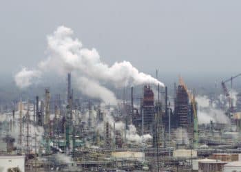 Oil refinery illustrating polluters must pay for heatwave costs
