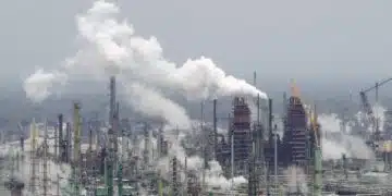 Oil refinery illustrating polluters must pay for heatwave costs