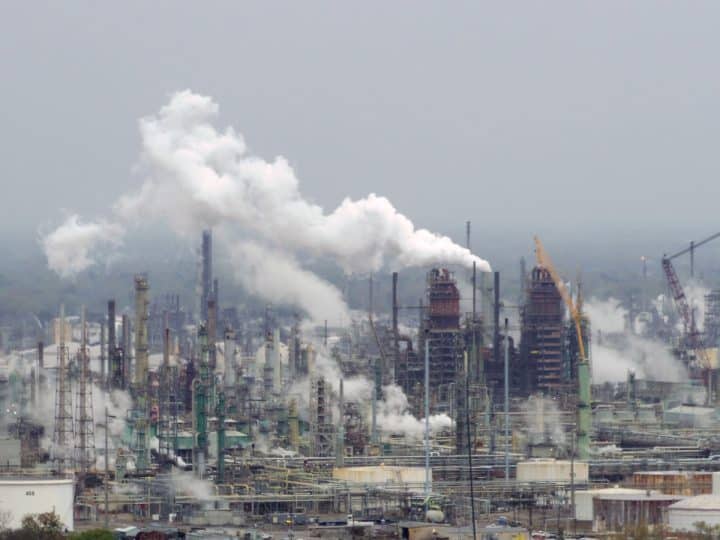 Oil refinery illustrating polluters must pay for heatwave costs