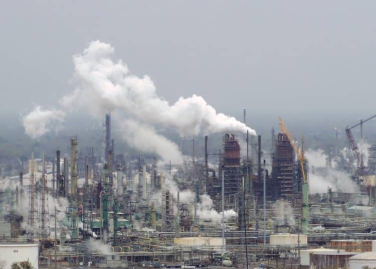 Oil refinery illustrating polluters must pay for heatwave costs