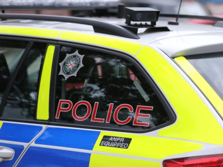 A stock image of the side of a PSNI vehicle