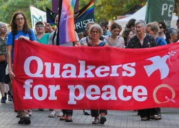 Quakers hold a banner saying Quakers For Peace Quakers in Britain comment on Palestine Action ban