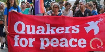 Quakers hold a banner saying Quakers For Peace Quakers in Britain comment on Palestine Action ban