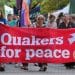 Quakers hold a banner saying Quakers For Peace Quakers in Britain comment on Palestine Action ban