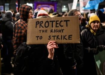 Home made placard saying: Protect The Right To Strike Strike days plummet