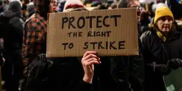 Home made placard saying: Protect The Right To Strike Strike days plummet