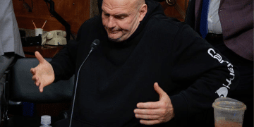 Senate Homeland Security and Governmental Affairs Committee member Senator John Fetterman shrugs after voting for Senator Markwayne Mullin to be Secretary of the Department of Homeland Security at the Dirksen Senate Office Building on Capitol Hill on 19 March 2026 in Washington, DC in the US