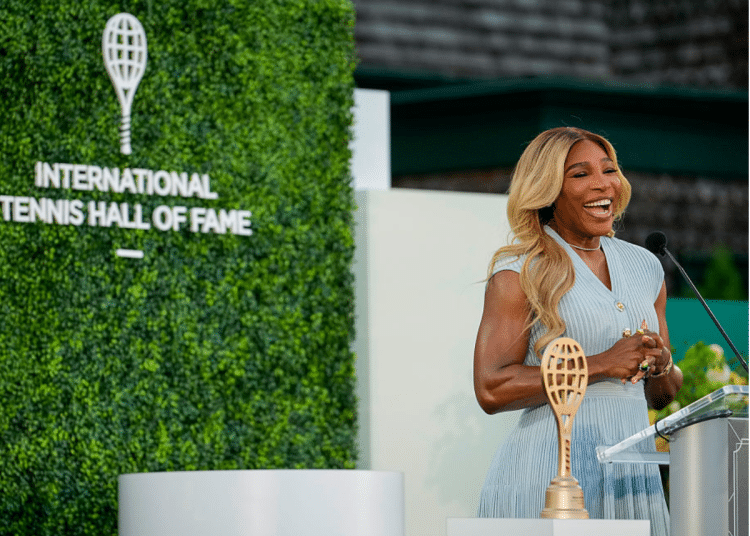 Serena Williams, looking glam in a smart tennis dress, introduces Maria Sharapova during the 2025 Induction Celebration weekend at the International Tennis Hall of Fame in Newport, R.I. on Saturday, August 23, 2025.