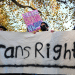 Trans rights activists hold placard