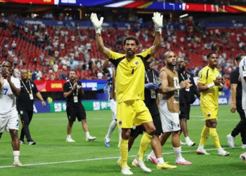 Vozinha, Cape Verde goalkeeper greets the crowd from the middle of the pitch with his hands up