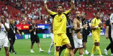 Vozinha, Cape Verde goalkeeper greets the crowd from the middle of the pitch with his hands up