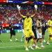 Vozinha, Cape Verde goalkeeper greets the crowd from the middle of the pitch with his hands up