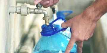 Running water Bottle filling up from tap