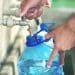 Running water Bottle filling up from tap