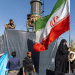 A woman is seen holding the Iranian Flag on June 15, 2026 in Tehran, Iran. According to reports, the U.S. and Iran have signed a preliminary agreement to end the war and open the Strait of Hormuz. The UAE is alleged to have agreed to unlock funds frozen in foreign banks under US sanctions for Iran.
