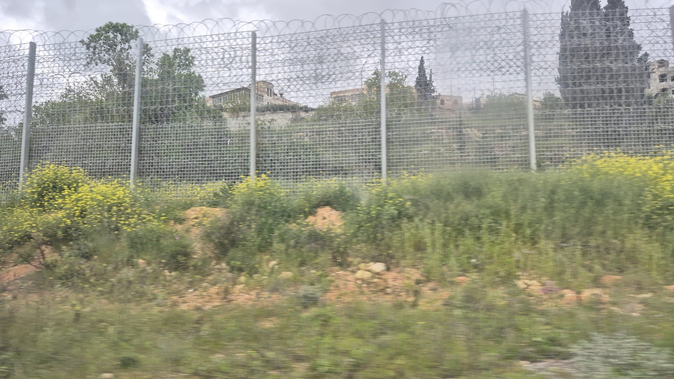 The six metre-high metal fence topped with razor wire
