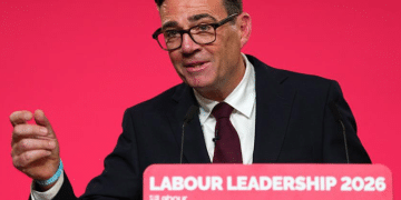 Andy Burnham on a podium speaking for the first time as the UK's Labour leader