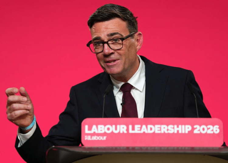 Andy Burnham on a podium speaking for the first time as the UK's Labour leader