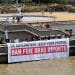 Campaigners display a banner reading UK Government Keep Your Promise Ban Foie Gras Imports