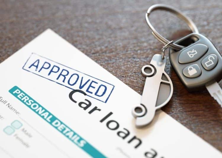 Image of car loan agreement and car key Economic abuse using car finance