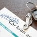 Image of car loan agreement and car key Economic abuse using car finance