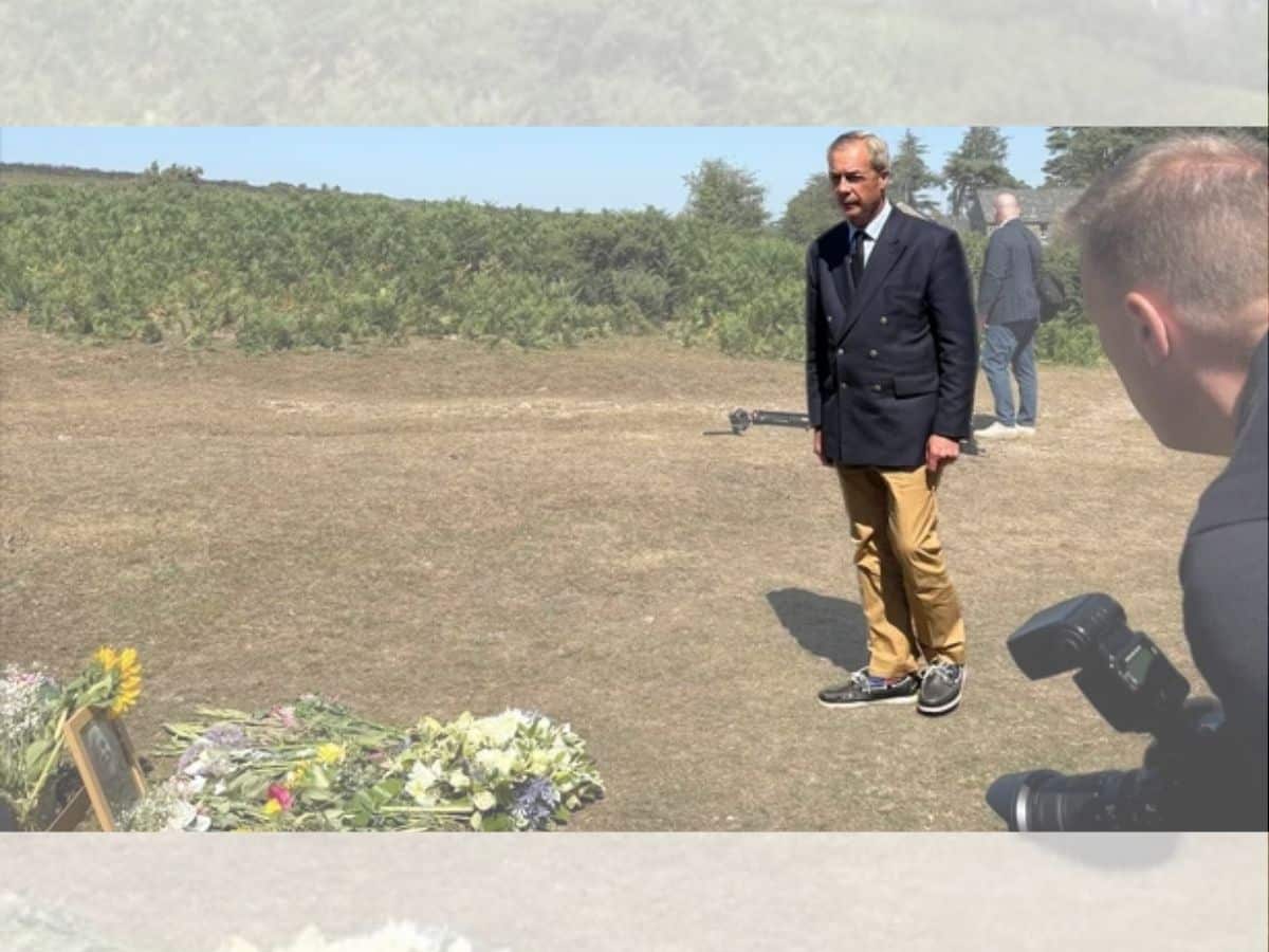 Nigel Farage laying a wreath in a field